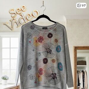 INOAH Long Sleeved Hi-Low Pullover Knit Top, Front Pocket Exterior Seams